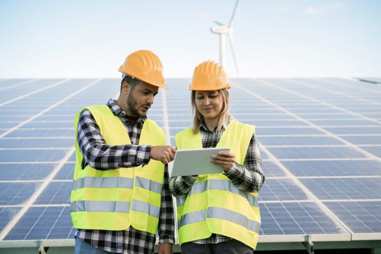 young-people-working-with-digital-tablet-at-renewable-energy-farm-focus-on-faces-e1641313571833